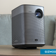 The XGIMI Halo+ projector sitting on a table.
